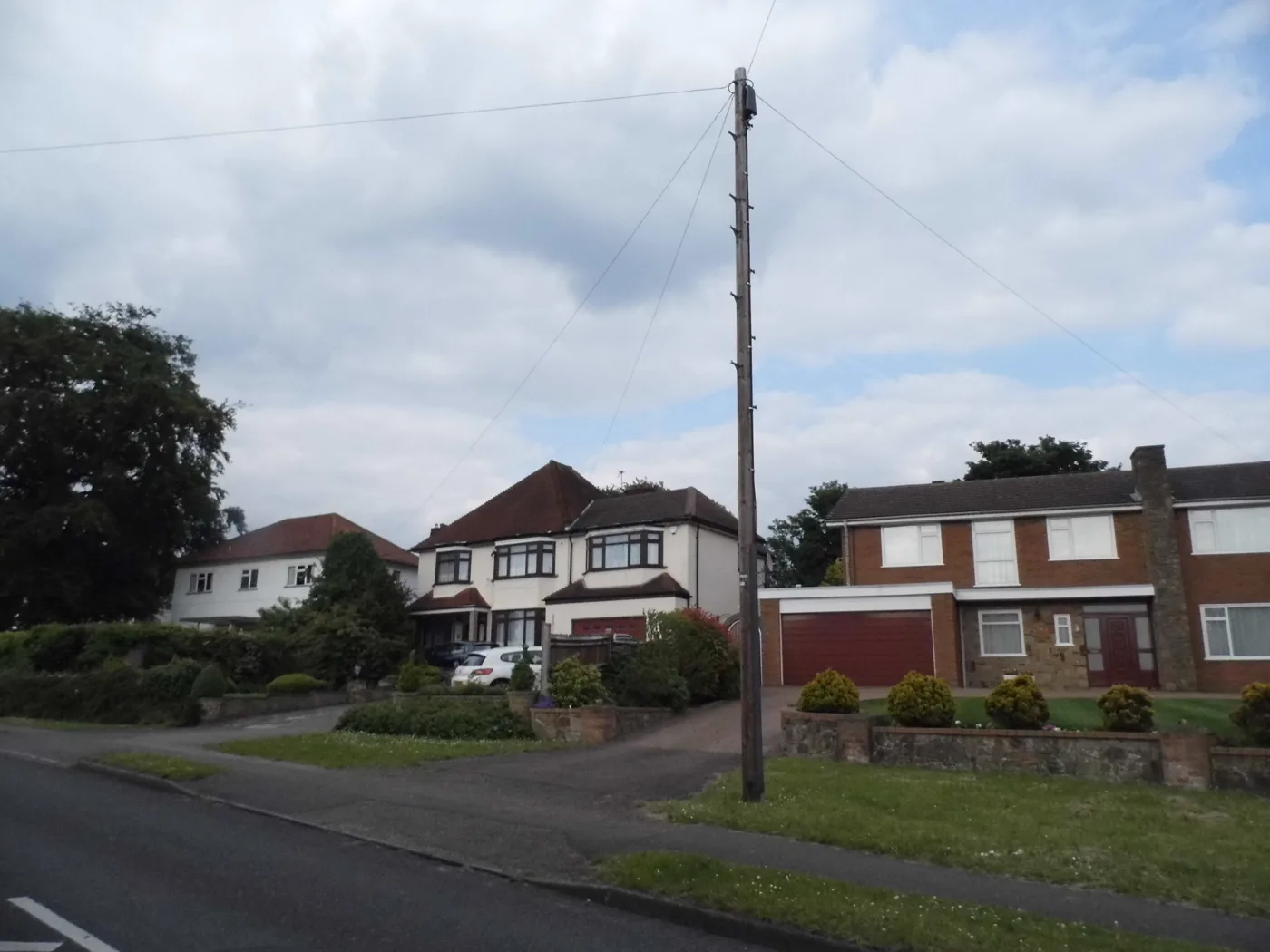 Houses on Longdown Lane North, Epsom. Every home in the borough gets refuse, mixed recycling, glass, textiles and food waste emptied weekly