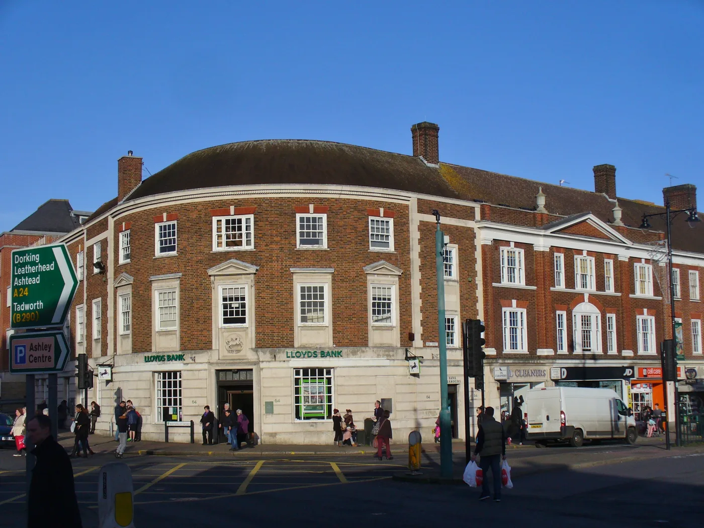 Epsom High Street at the Waterloo Road junction, with the Ashley Centre car park signed to the left